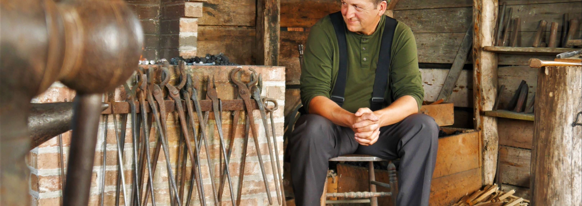 Man Sitting in Blacksmith Shop