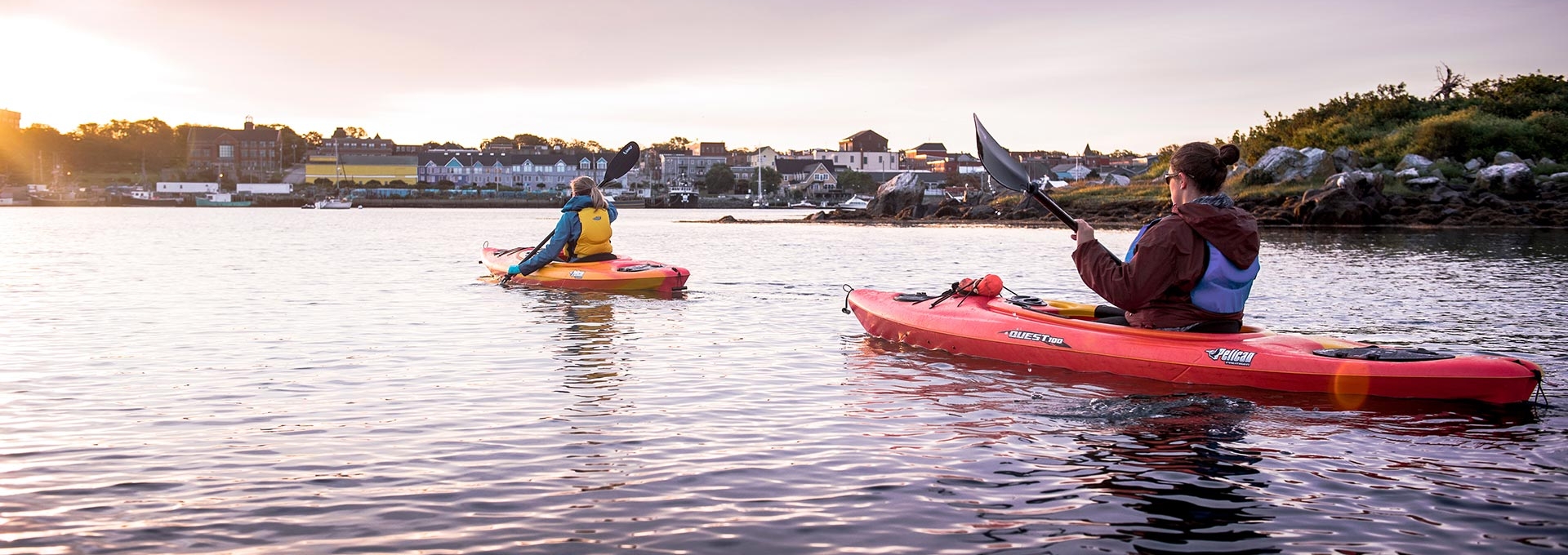 Two women kayaking on a lake