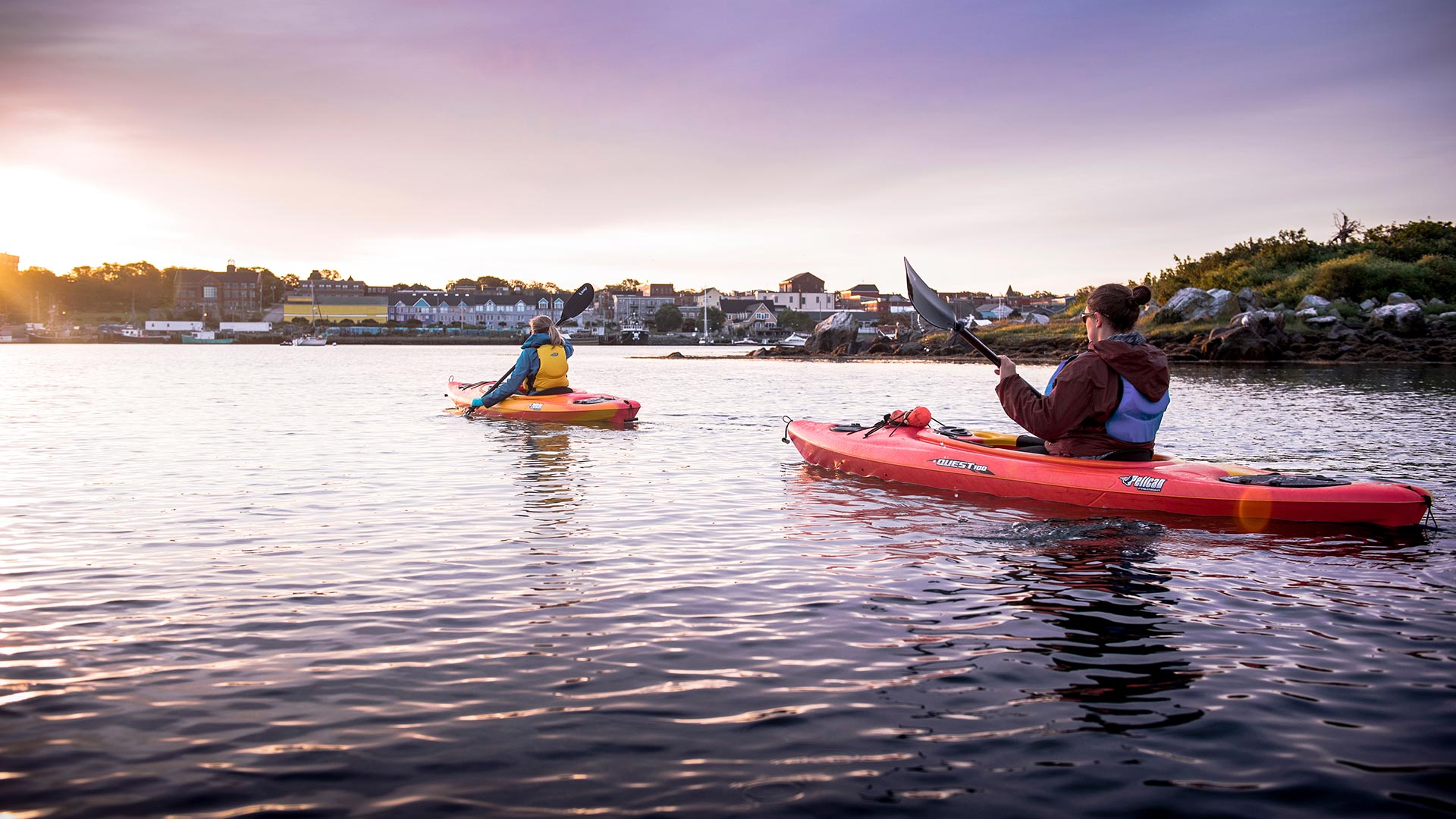 Two women kayaking on a lake